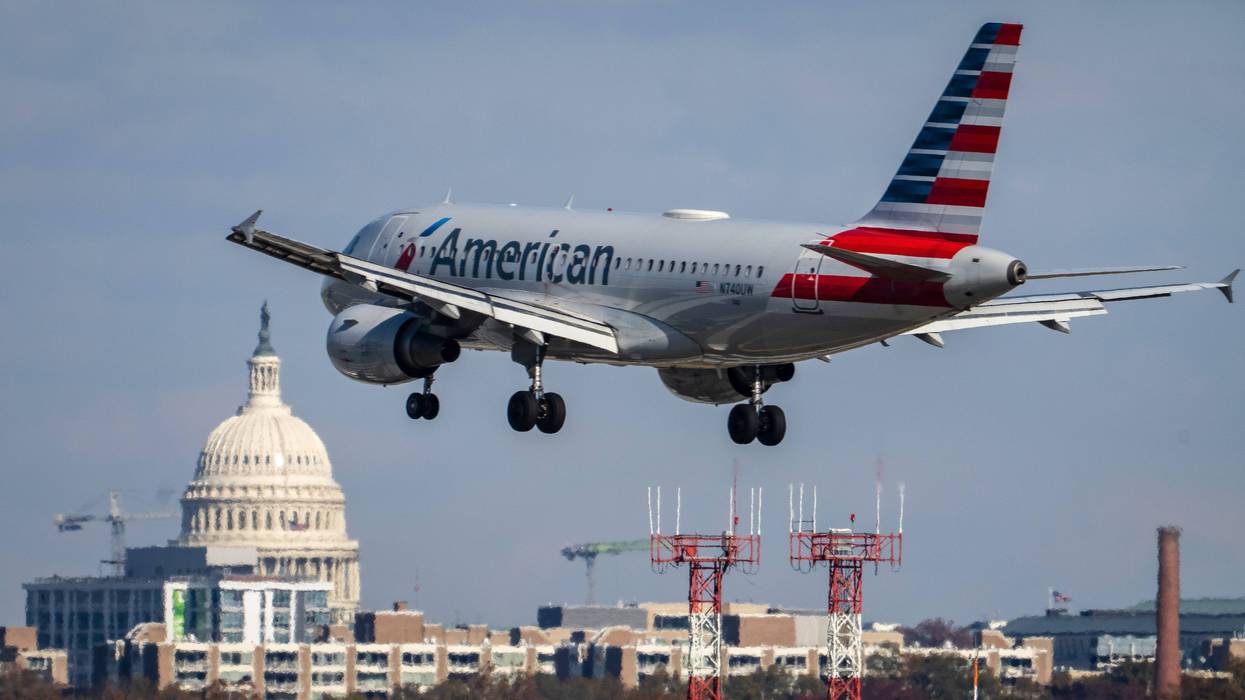An American Airlines plane lands at Ronald Reagan Washington National Airport November 23, 2021 in Arlington, Virginia.