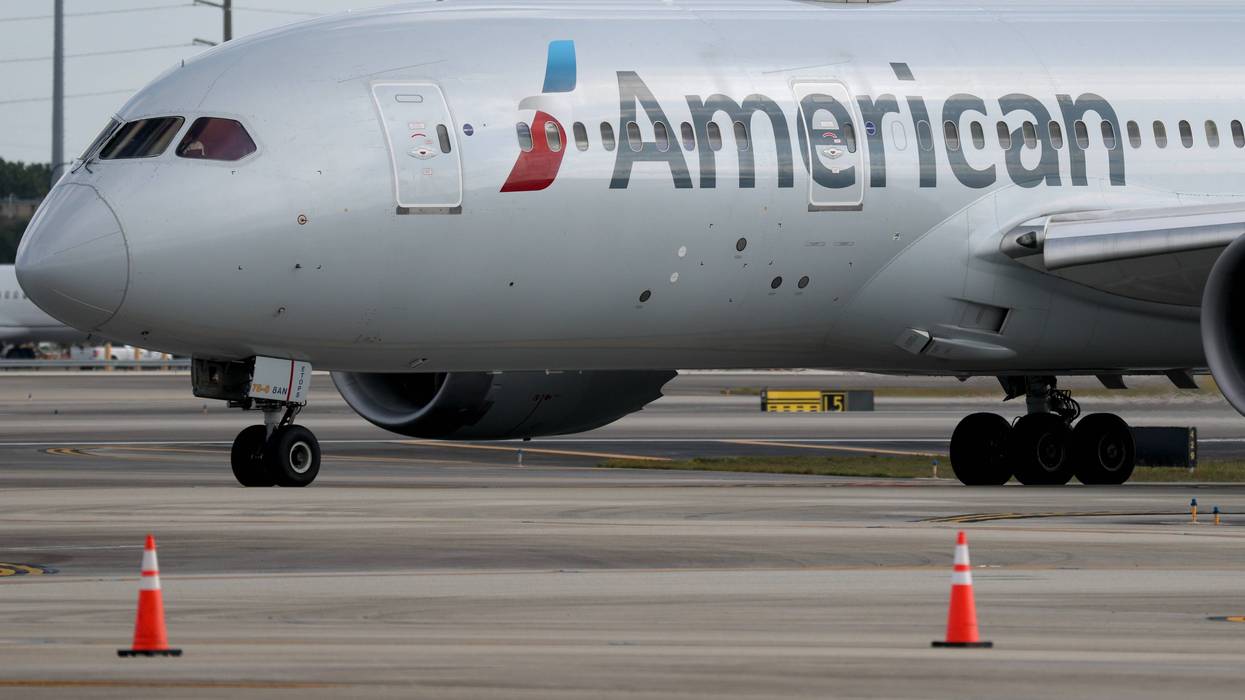 An American Airlines plane sits on the tarmac