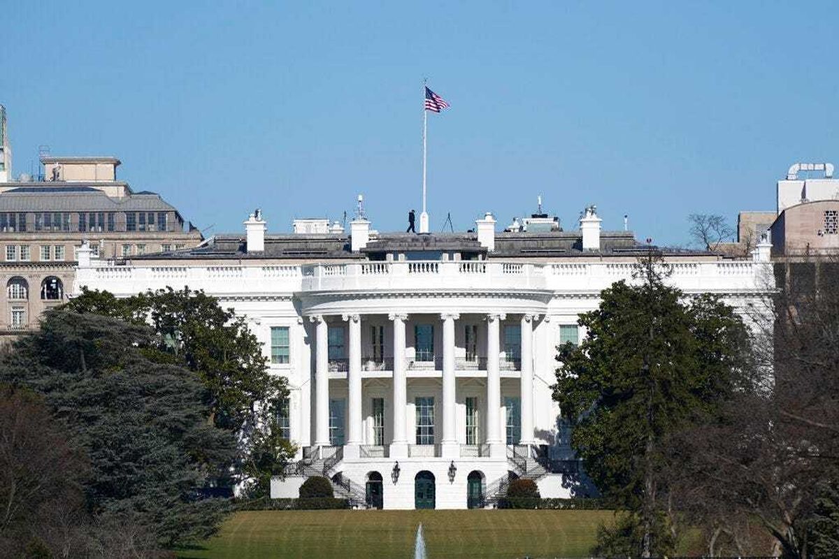An American flag flies above the White House in Washington, Saturday, Jan. 9, 2021.