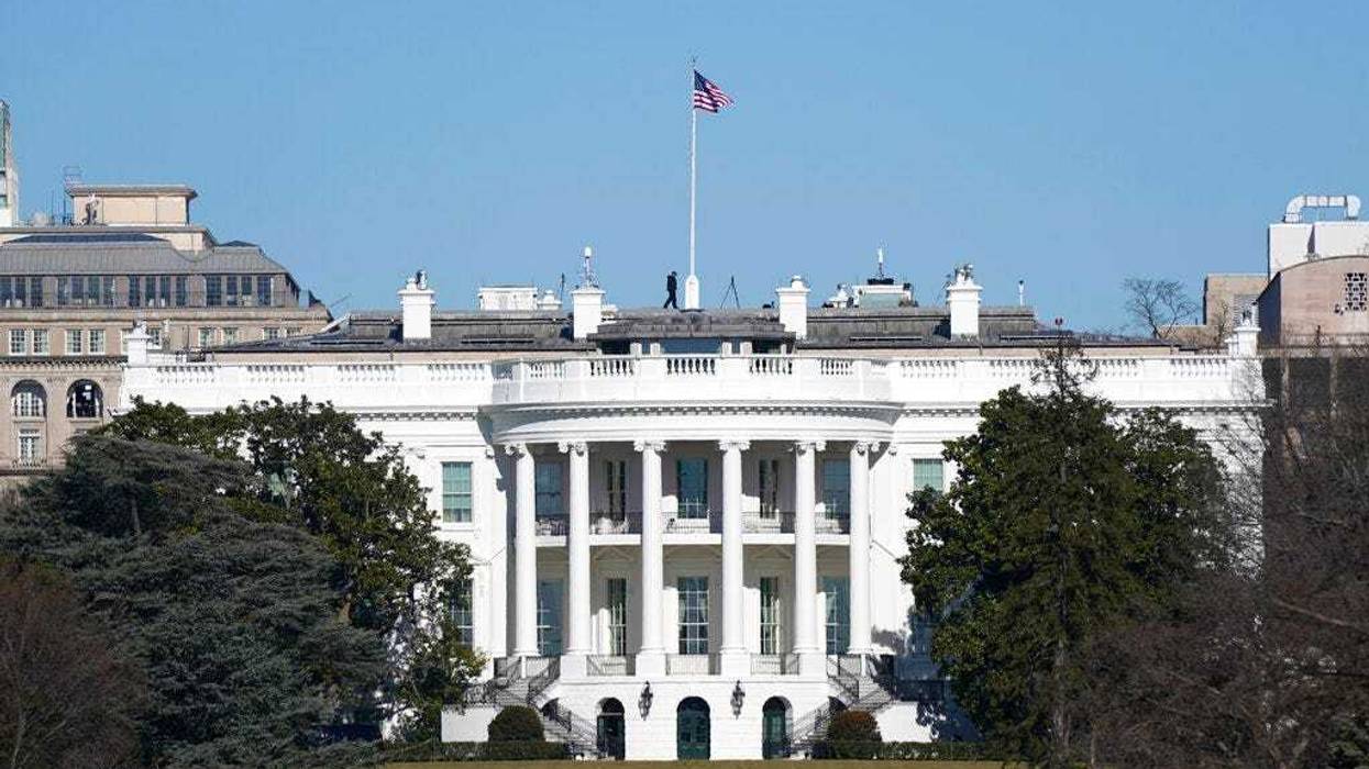 An American flag flies above the White House in Washington, Saturday, Jan. 9, 2021.
