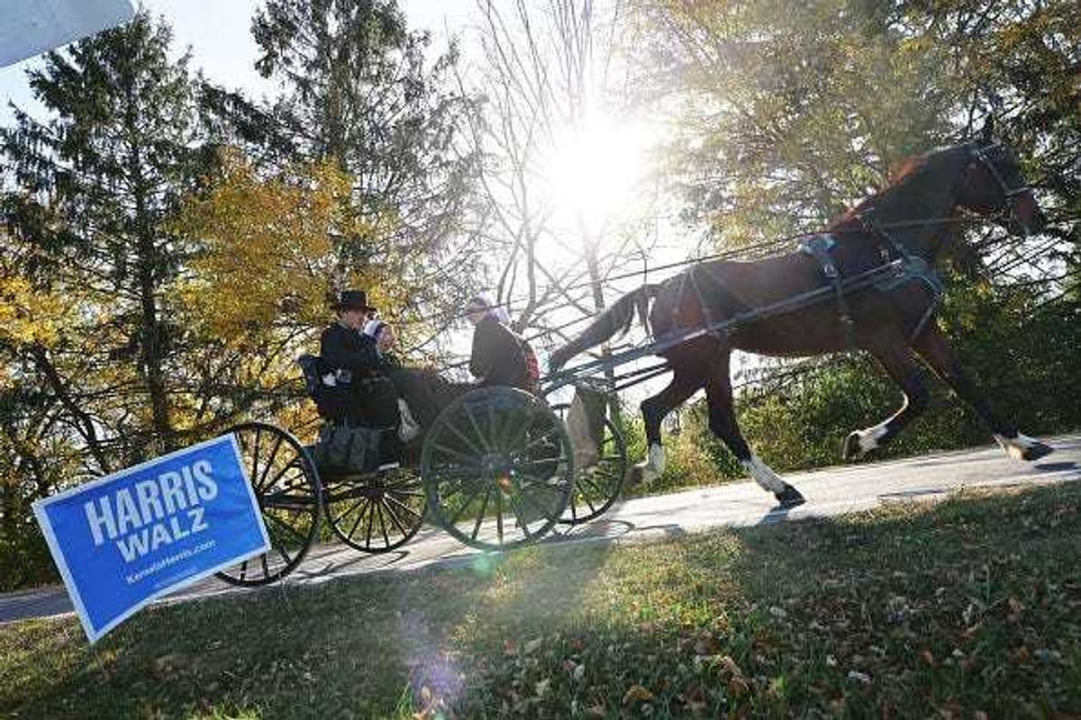 An Amish buggy rides past a Democratic presidential nominee, U.S. Vice President Kamala Harris campaign sign on November 03, 2024 in Lititz, Pennsylvania.
