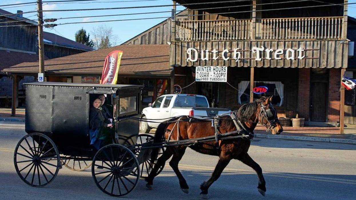 An Amish carriage passes the Dutch Treat restaurant in Spartansburg, Pa., on Thursday, Feb. 29, 2024. The body of a pregnant 23-year-old Amish woman was discovered on Monday in her home a few miles outside of Spartansburg. Pennsylvania State Police are appealing for tips from the public to help solve the crime, a state police spokeswoman said Wednesday.