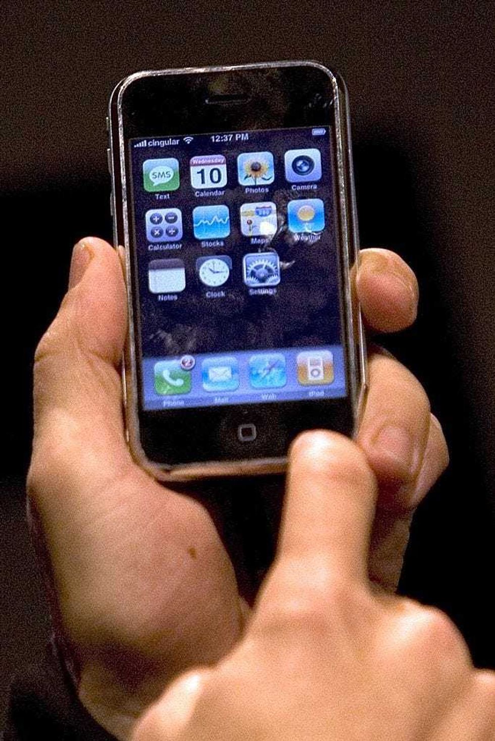 An Apple employee gives a demonstration of the new iPhone at MacWorld on January 10, 2007 in San Francisco, California. The device which is controlled by a touch screen is set to launch in June 2007. It will play music, surf the Internet and deliver voice mail and e-mail. According to reports, Cisco Systems Inc. is suing Apple Inc. for using Cisco
