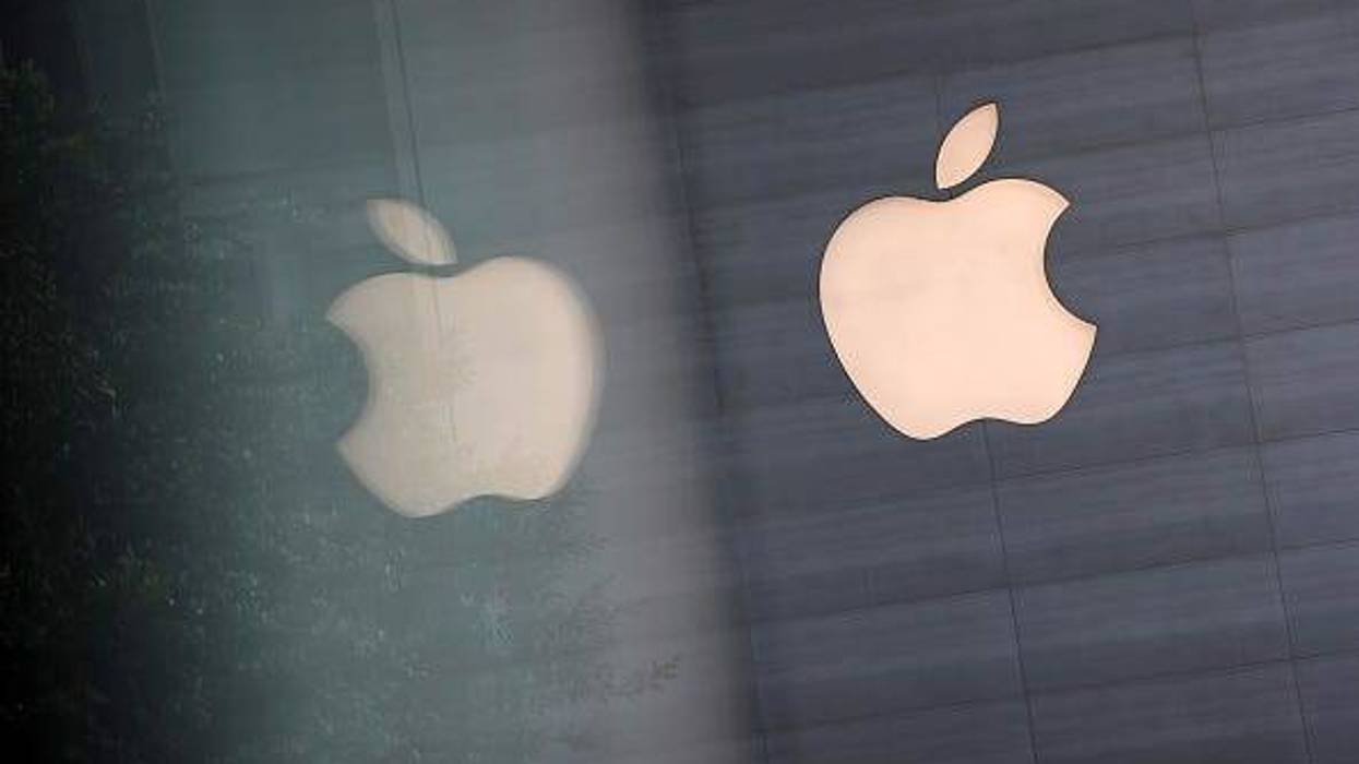 An Apple logo is reflected on glass at the Apple Store at Orchard Road on September 24, 2021 in Singapore.