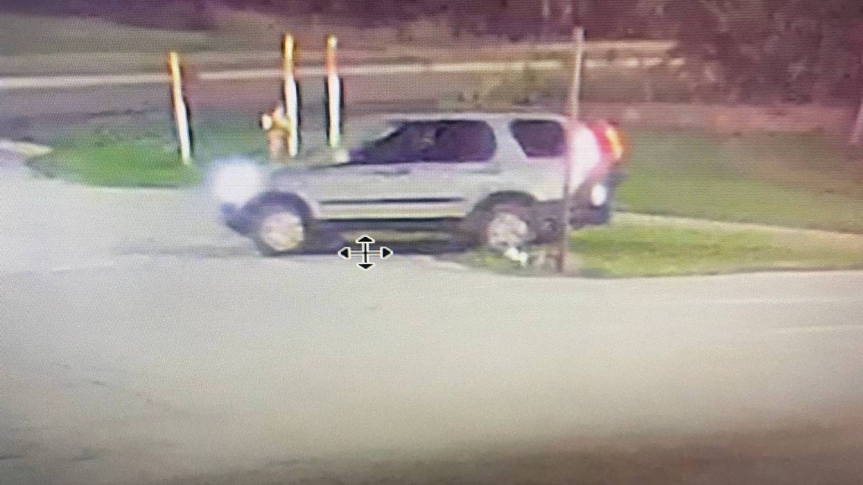 An armed and dangerous suspect is on the loose in the Upper Peninsula after a number of Michigan State Police patrol cars were targeted by gunfire and engulfed in flames early Wednesday morning.