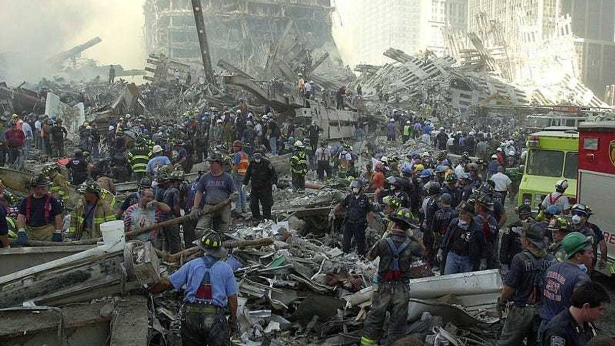 An army of rescue workers sifts through the rubble at Ground Zero on Sept. 12, 2001 during search and rescue efforts. rubble ground zero