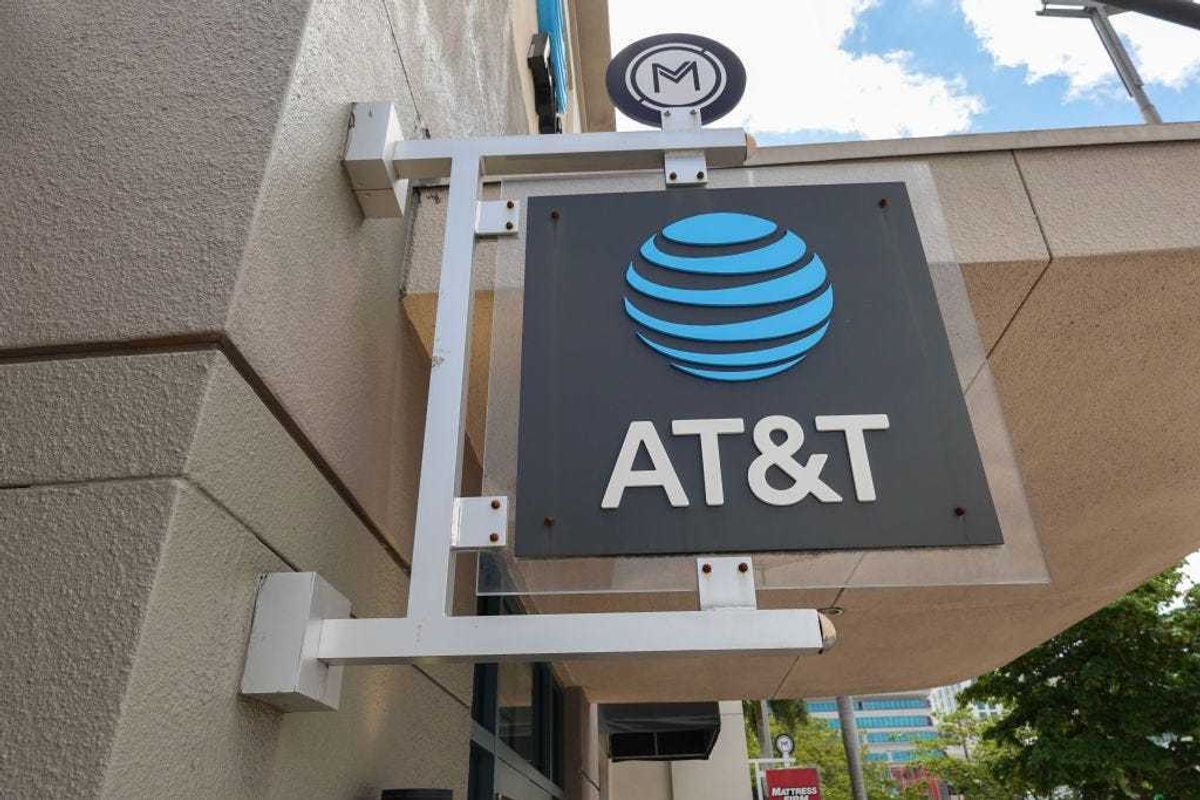 An AT&T sign hangs outside of a store on April 01, 2024, in Miami, Florida. AT&T acknowledged a massive leak involving the data of 73 million current and former subscribers. They reported that they had reset passcodes for millions of customers after the hack. (Photo by Joe Raedle/Getty Images)