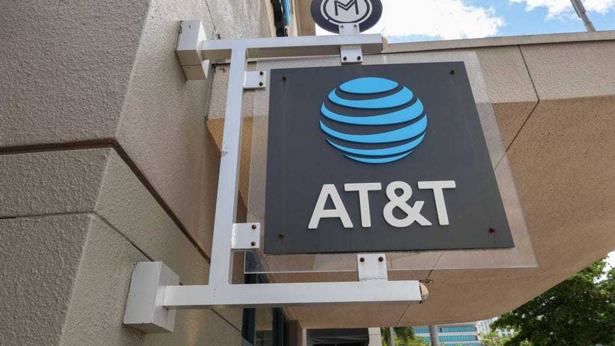 An AT&T sign hangs outside of a store on April 01, 2024, in Miami, Florida. AT&T acknowledged a massive leak involving the data of 73 million current and former subscribers. They reported that they had reset passcodes for millions of customers after the hack. (Photo by Joe Raedle/Getty Images)
