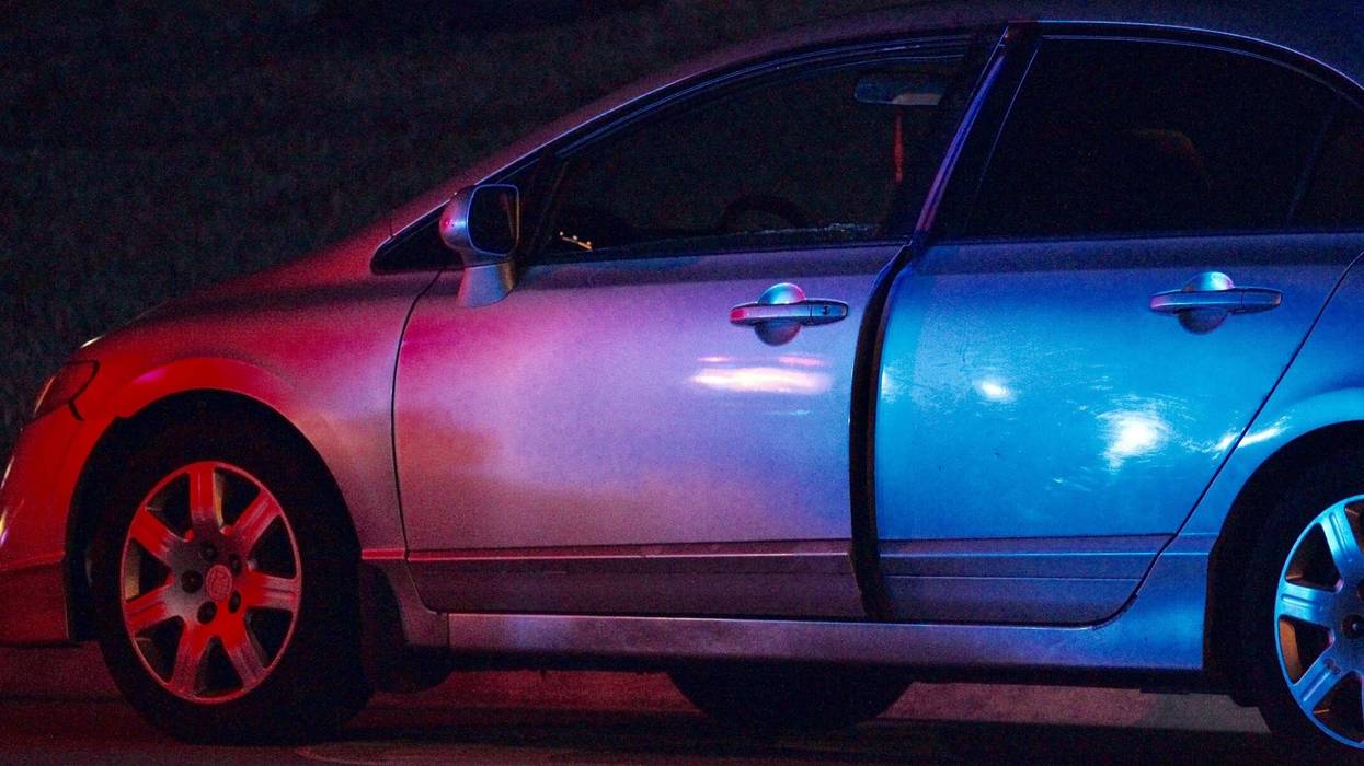 An attempted carjacked Honda Civic is seen along the side on a road