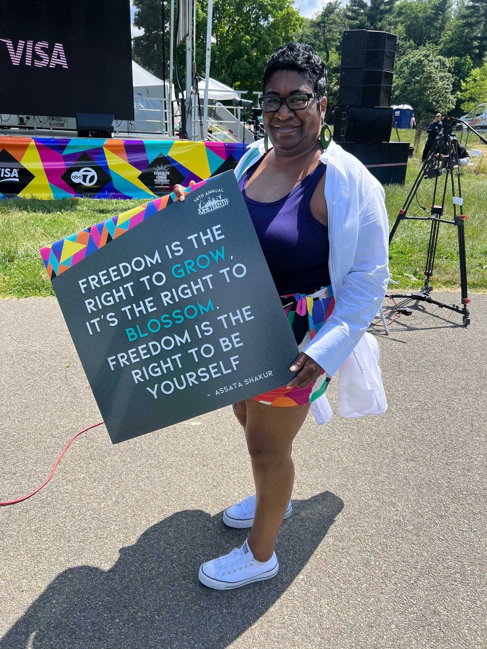 An attendee holds a sign at Sunday