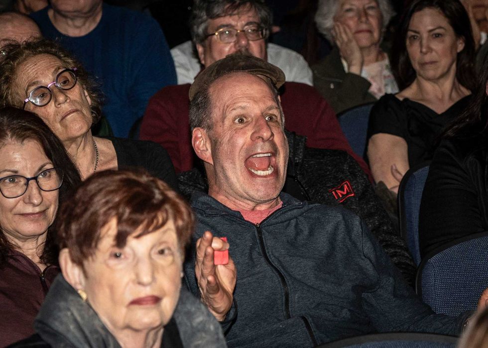An attendee reacts to a comment by U.S. Rep. Mike Lawler during a town hall event at Clarkstown South High School in West Nyack April 27, 2025