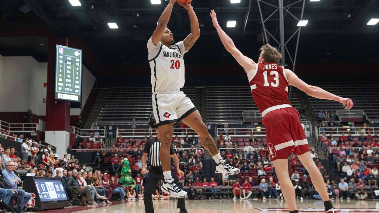 an Diego State Aztecs guard Matt Bradley shoots over Stanford Cardinal guard Michael Jones during the first half at Maples Pavilion