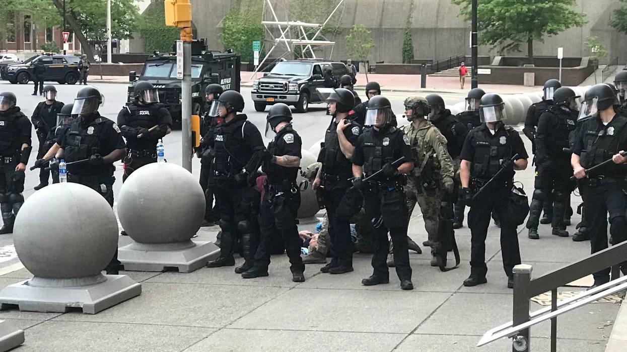 An elderly man is pushed by Buffalo Police when clearing Niagara Square. June 4, 2020