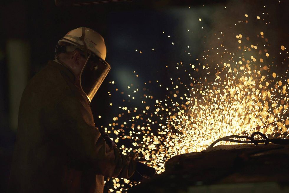 An employee of Doe Run Resources Corp. works to produce lead metals and alloys
