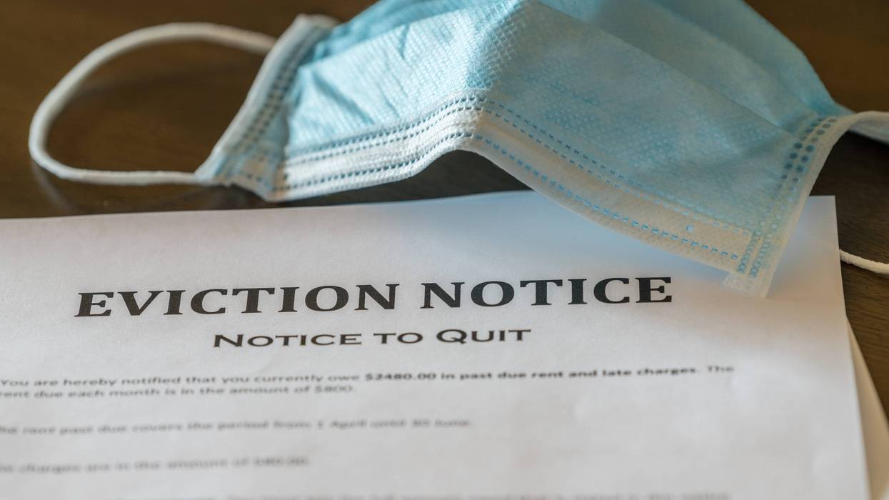 An eviction notice is served during the coronavirus pandemic