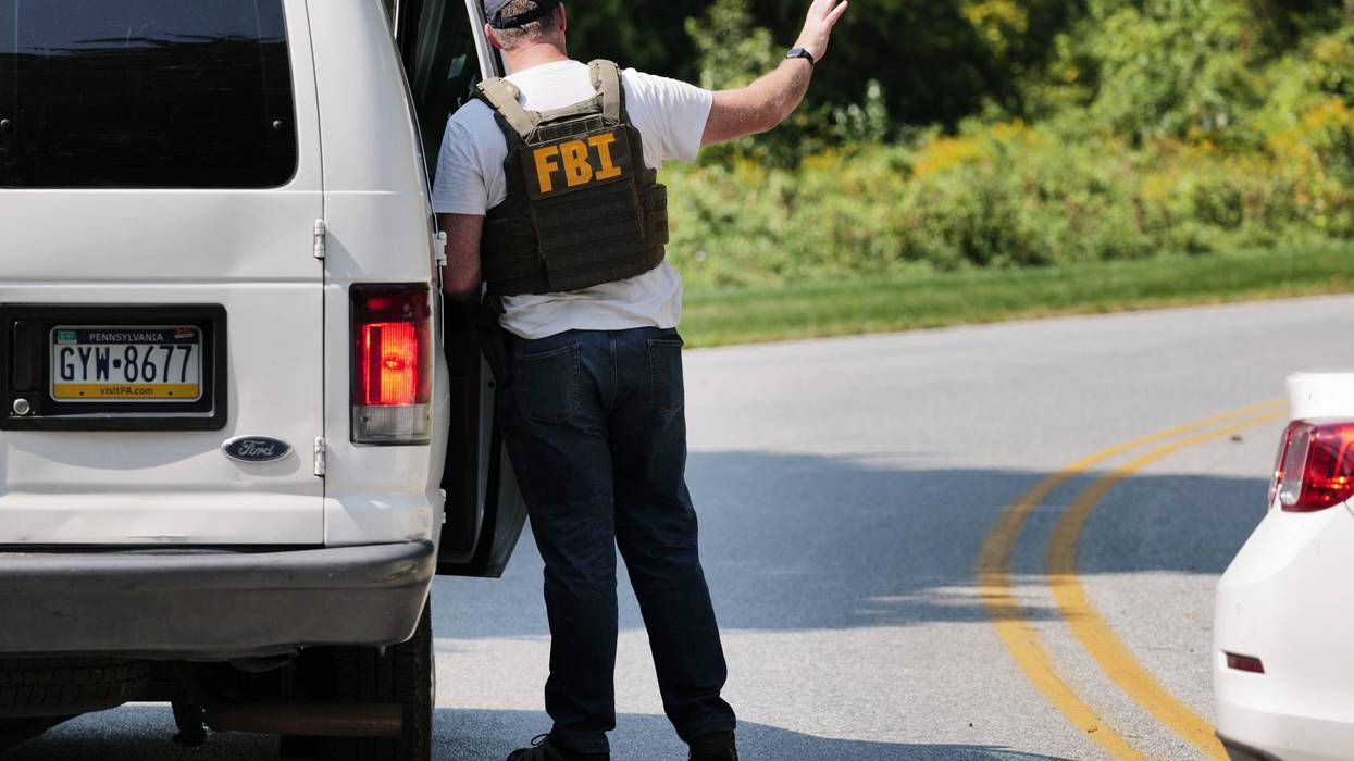 An FBI agent works with Pennsylvania and local police on the perimeter of a search zone for escaped prisoner Danilo Cavancante in September 2023.