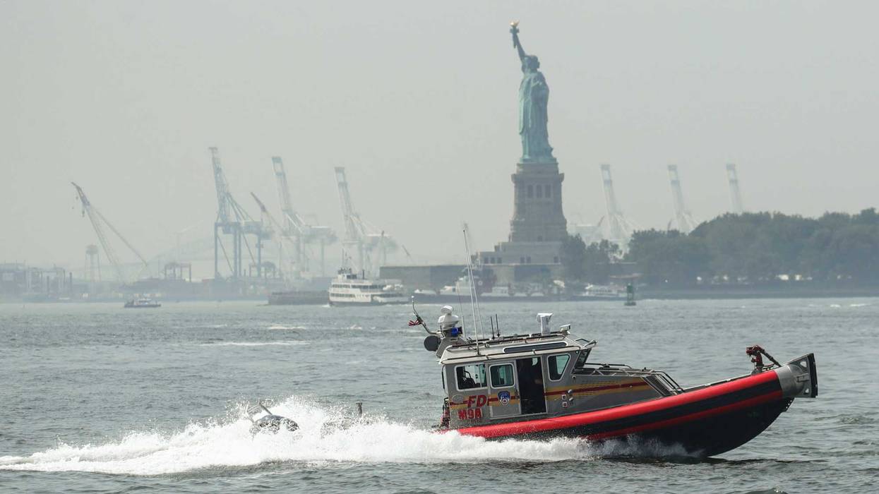 An FDNY boat cruises through New York Harbor.
