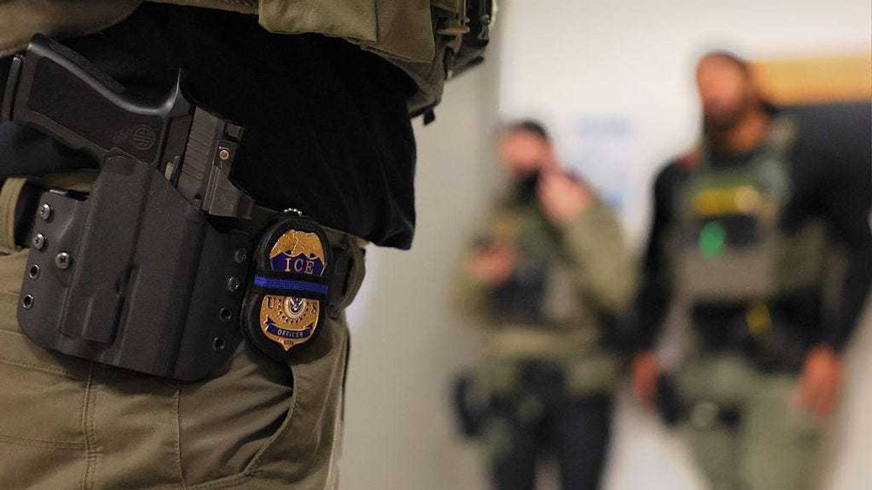 An ICE officers badge is seen as federal agents patrol the halls of immigration court at the Jacob K. Javitz Federal Building on June 10, 2025 in New York City.