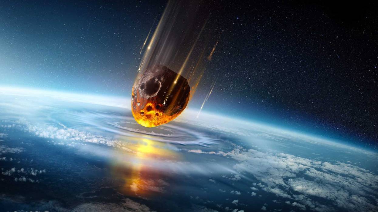 An illustration of an asteroid hitting the Earth.