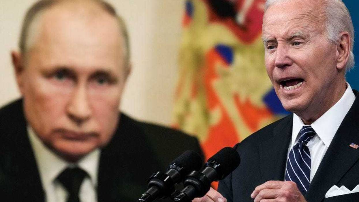 An image of Russian President Vladimir Putin is displayed as U.S. President Joe Biden speaks about gas prices in the South Court Auditorium at the White House campus on June 22, 2022 in Washington, DC.