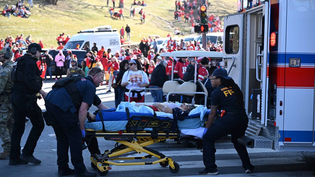 An injured person is loaded on an ambulance near the Kansas City Chiefs' Super Bowl LVIII victory parade on February 14, 2024, in Kansas City, Missouri.