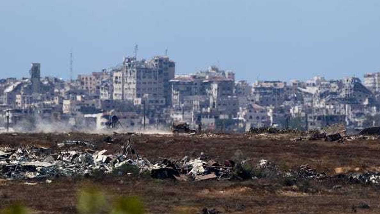An Israeli army vehicle moves in the Gaza Strip as seen from a position on the Israeli side of the border on June 17, 2024 in Southern Israel, Israel.