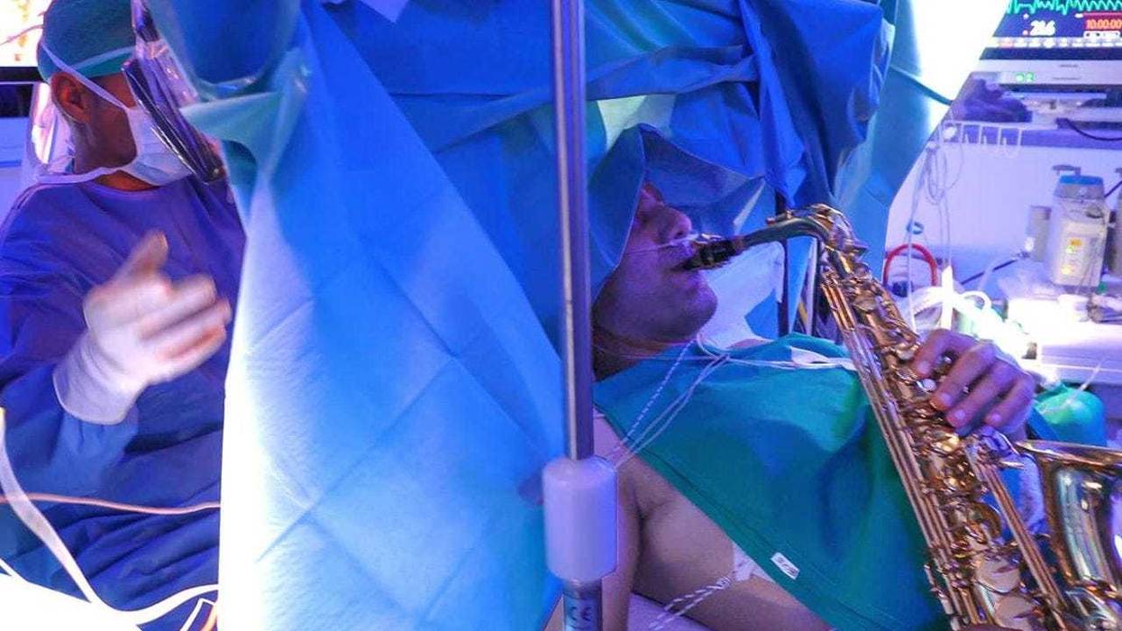 An Italian musician plays the saxophone while having brain surgery.