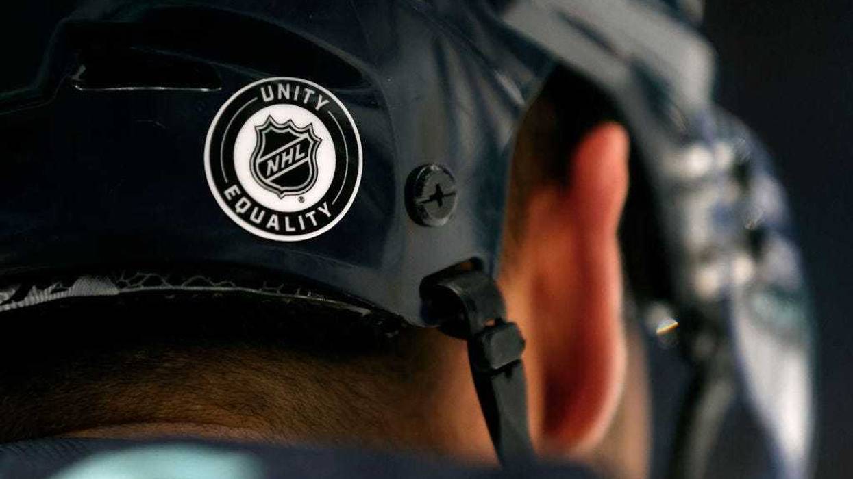 An NHL logo displaying unity and equality is seen on the helmet on Jordan Eberle #7 of the Seattle Kraken as he warms up before the game against the Calgary Flames at Climate Pledge Arena on December 28, 2022 in Seattle, Washington.