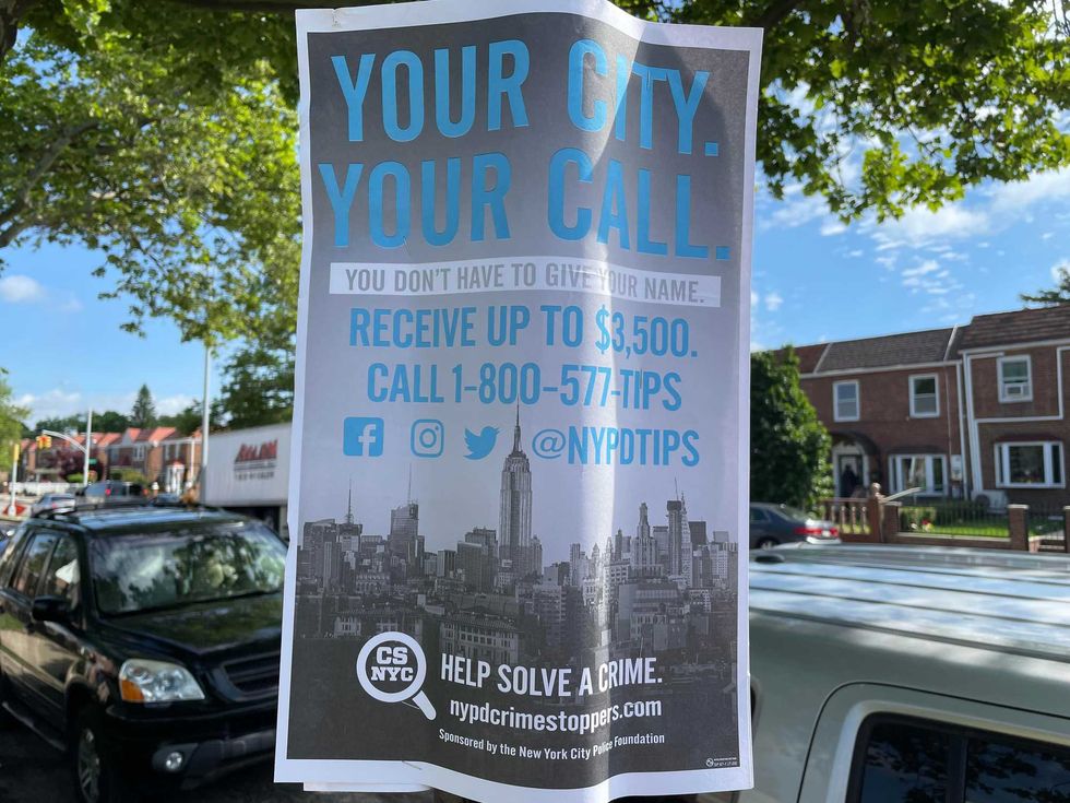 An NYPD Crime Stoppers poster near the scene of Tuesday night