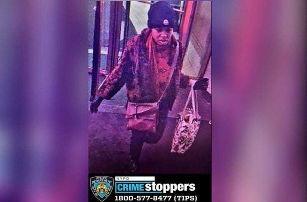 An NYPD photo shows the woman sought in a bottle attack on a subway performer at the Herald Square subway station