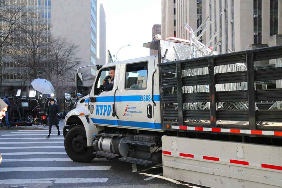 An NYPD truck carries barricades in Lower Manhattan on March 20, 2023