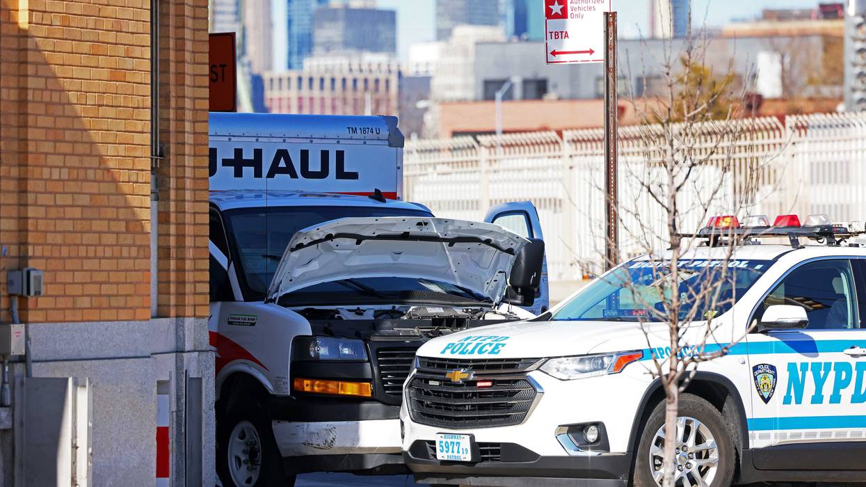 An NYPD vehicle is seen parked in front of a crashed U-Haul truck on Hamilton Avenue on Feb. 13, 2023, in Red Hook