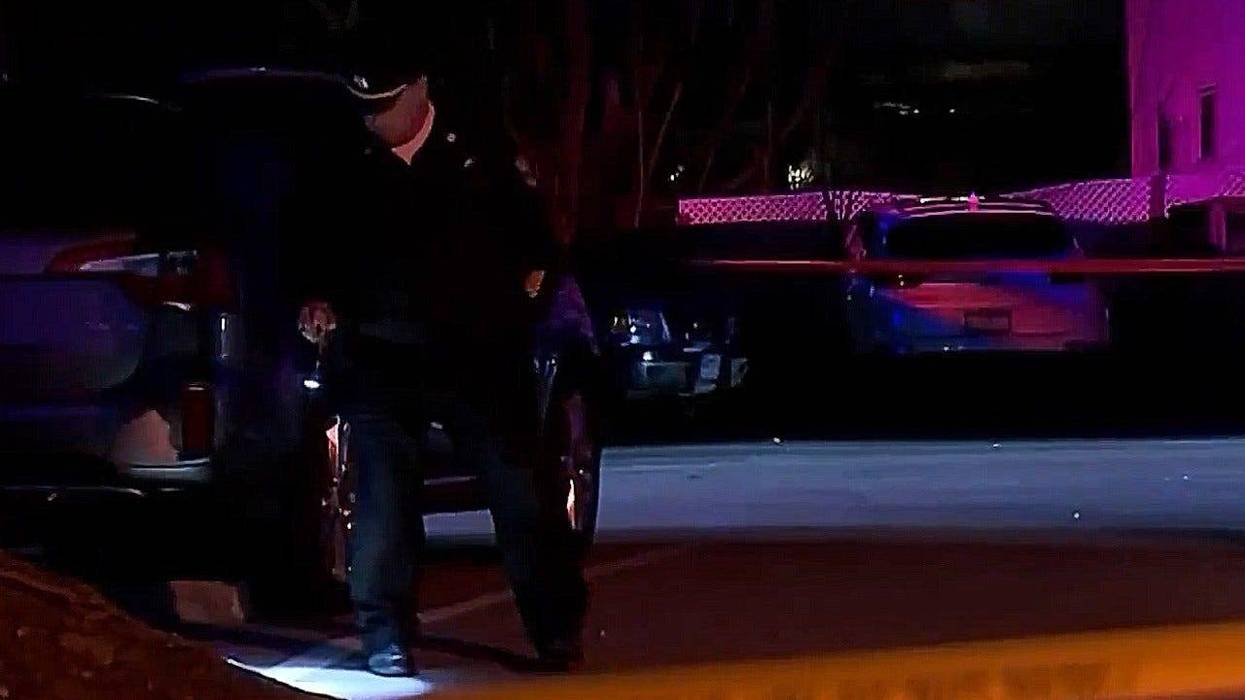 An officer investigates at the scene of a Tuesday night shooting in Roxborough that killed 32-year-old Tariq Duncan.