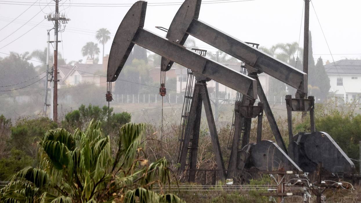 An oil pumpjack (R) operates as another (C) stands idle on March 28, 2022 in Los Angeles, California.