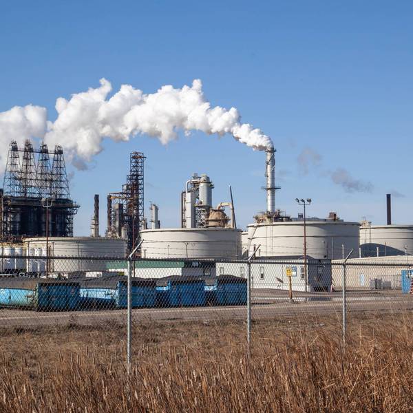 An oil refinery facility skyline. An oil refinery is a facility that takes crude oil and distills it into various useful petroleum products.