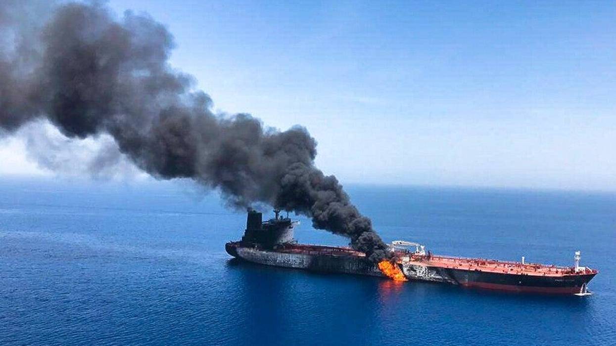 An oil tanker is on fire in the sea of Oman, Thursday, June 13, 2019. Two oil tankers near the strategic Strait of Hormuz were reportedly attacked on Thursday, an assault that left one ablaze and adrift as sailors were evacuated from both vessels and the