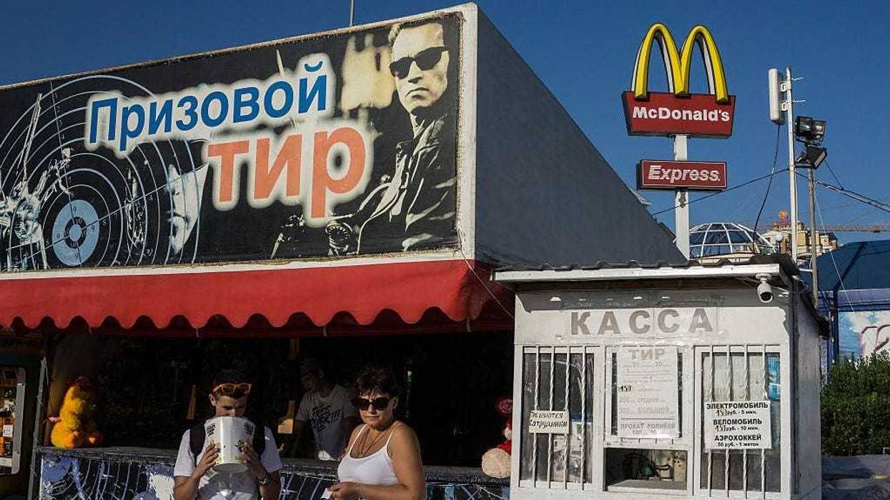 An old McDonalds sign is seen on embankment on August 10, 2015 in Yalta, Crimea.
