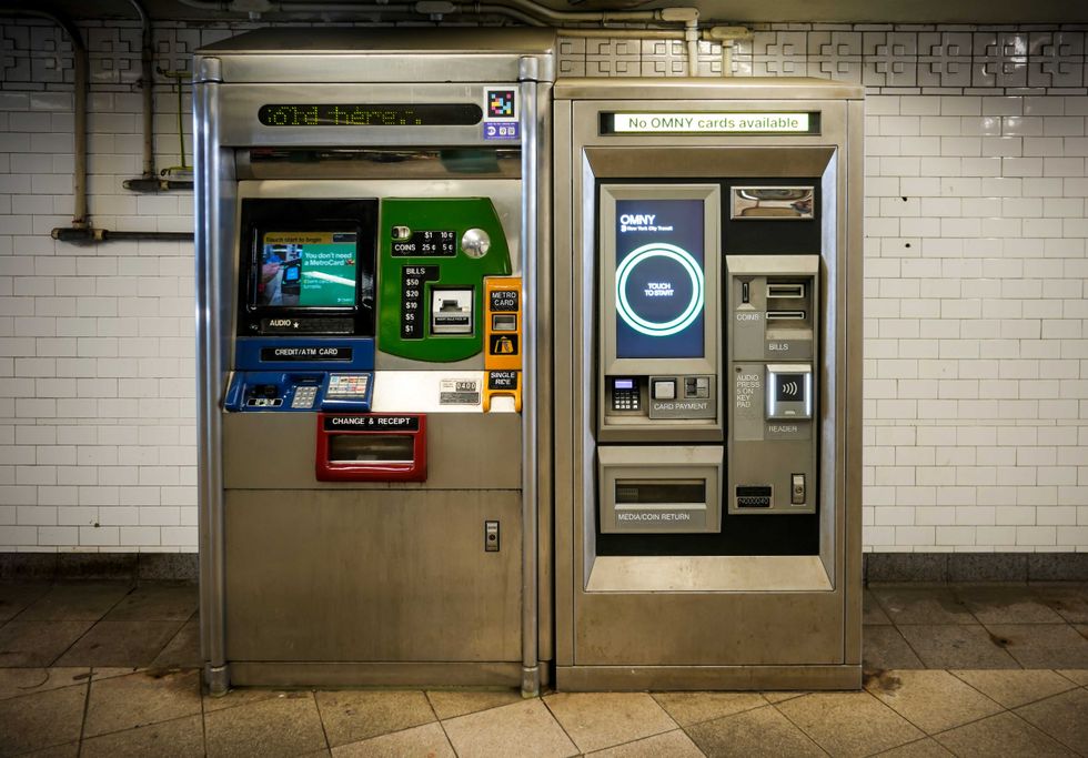 An OMNY Card machine sits next to a soon to be discontinued MetroCard machine in the Union Square subway station earlier this year