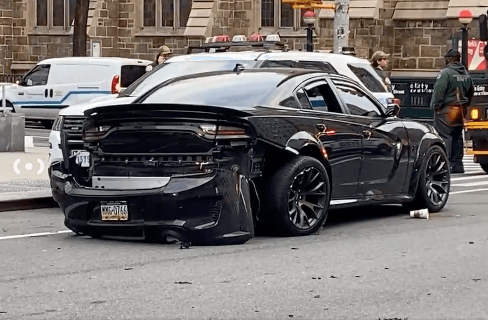 An out-of-control driver pinned an on-duty police officer in Greenwich Village Friday morning,