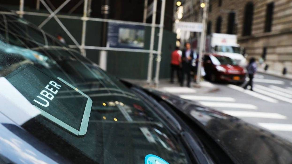 An Uber car waits for a client in Manhattan a day after it was announced that Uber co-founder Travis Kalanick will take a leave of absence as chief executive on June 14, 2017 in New York City.