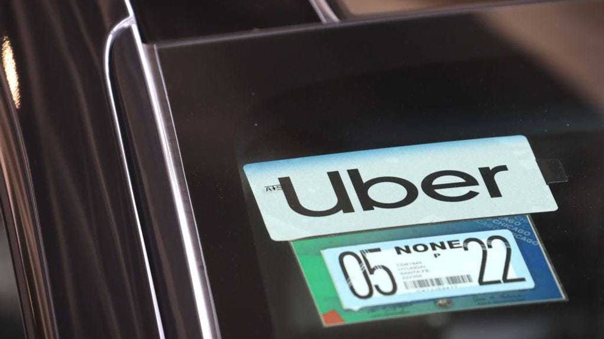 An Uber driver arrives to pick up a passenger at Midway International Airport on May 09, 2022 in Chicago, Illinois.