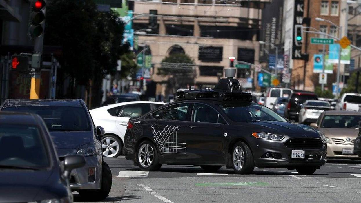 An Uber self-driving car drives down 5th Street on March 28, 2017 in San Francisco, California. Cars in Uber's self-driving cars are back on the roads after the program was temporarily halted following a crash in Tempe, Arizona on Friday.