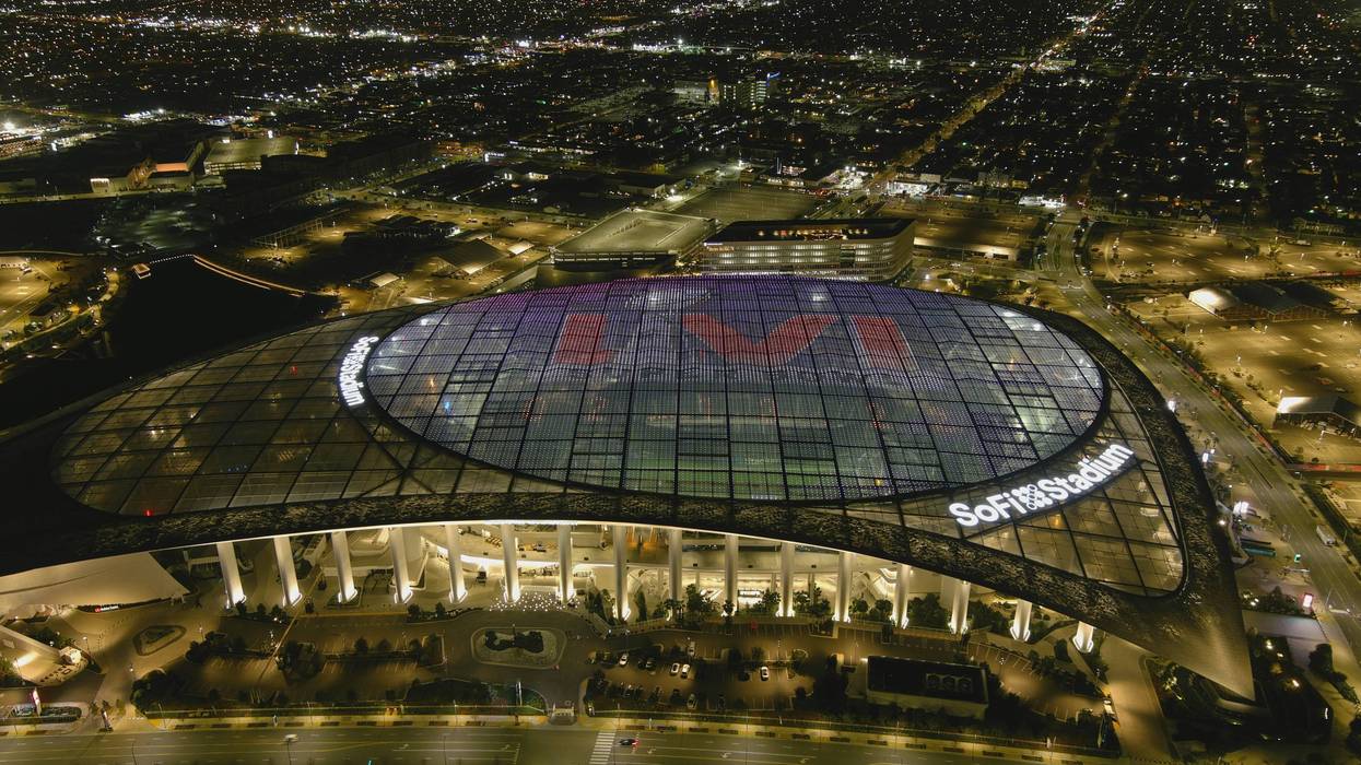 An undated aerial view of SoFi Stadium with Super Bowl LVI logo projected on the roof.