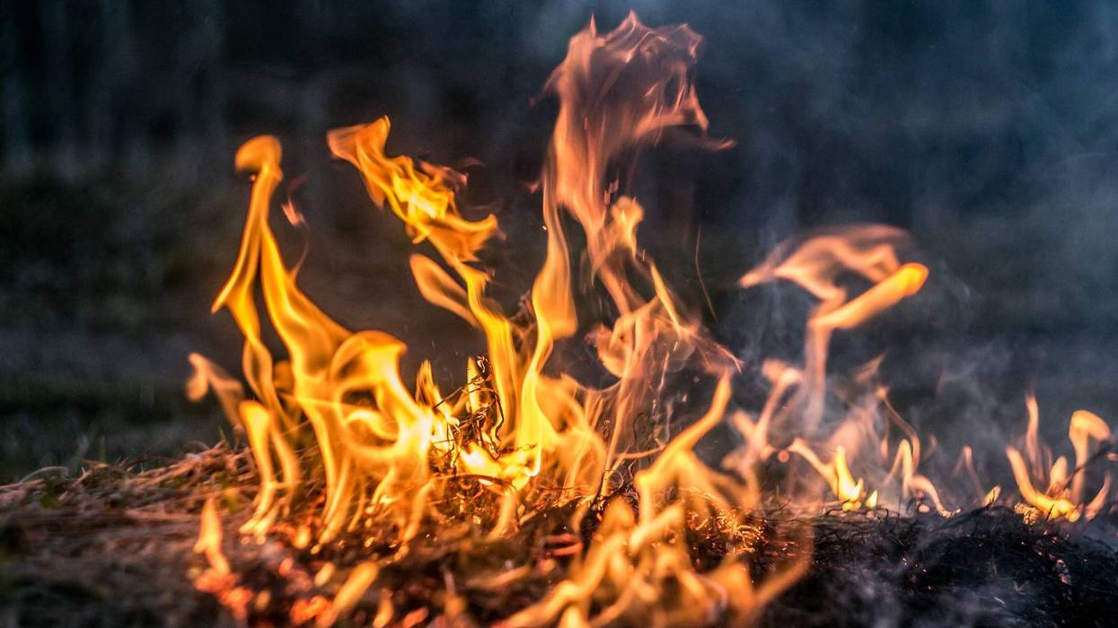 An undated close up picture of grass fire flames.