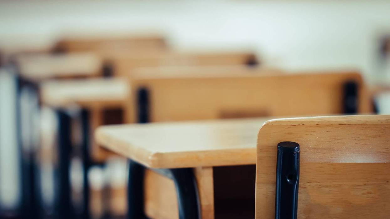 An undated picture of an empty school classroom.