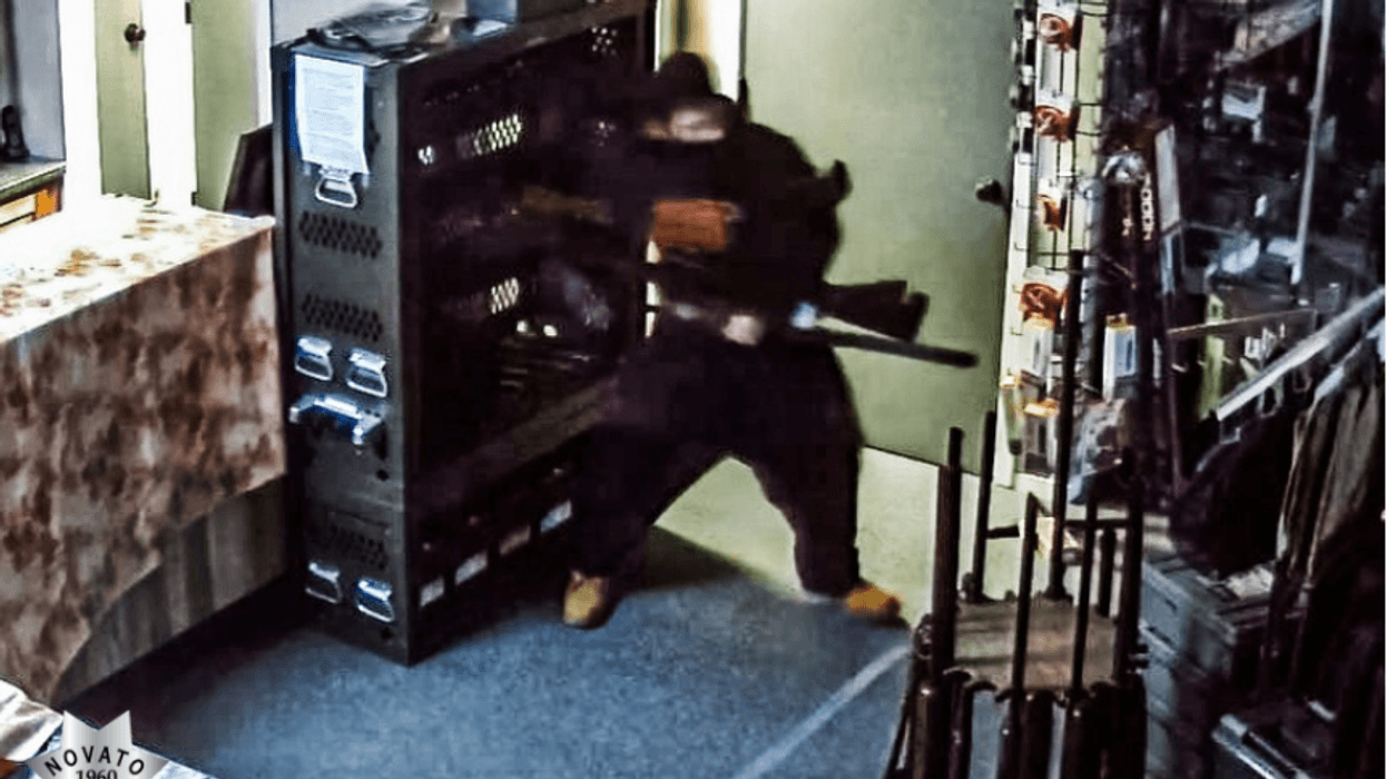 An unidentified man with light or tan completion and short dark hair appears to rummage through inventory after using his vehicle to break into Marin Firearms on Thursday morning.