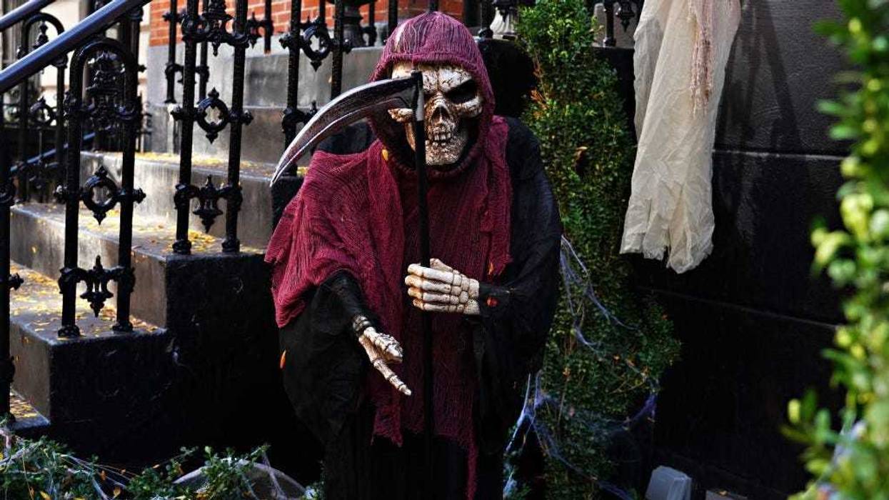 An Upper East Side home is decorated with a Grim Reaper skeleton for Halloween on October 31, 2020 in New York City.