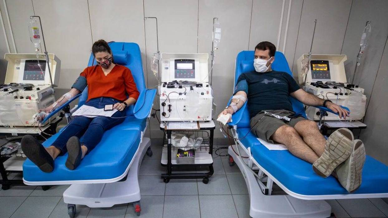 Andre Magalhaes, nurse, donates plasma through a process called plasmapheresis at Hemorio amidst the coronavirus (COVID-19) pandemic on June 5, 2020 in Rio de Janeiro, Brazil. Hemorio is one of the institutions that uses plasma transfusion technology, when the blood of patients that survived COVID-19 is utilized to strengthen the immunity of other victims infected by the virus. Hematologist Alvaro D'alincourt works at Hemorio on the front lines of fighting the virus, and is happy with the results of the transfusions. He claims two employees had the disease and responded very well to the use of plasma.