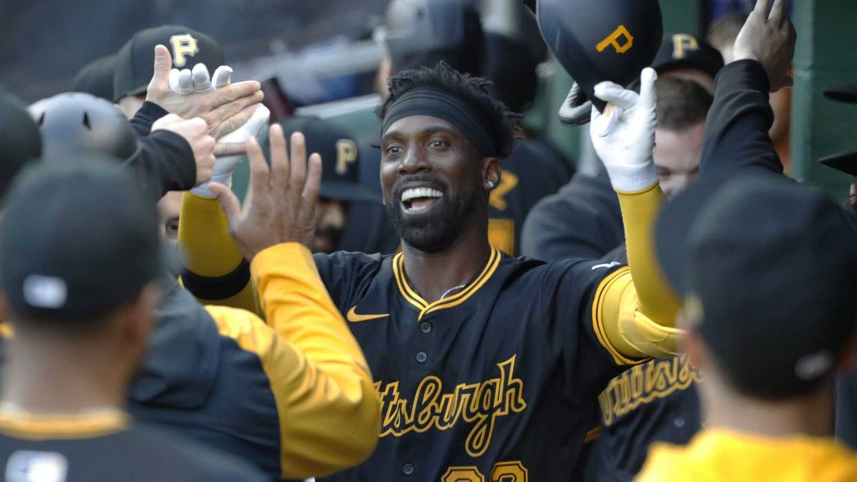 Andrew McCutchen celebrating in dugout
