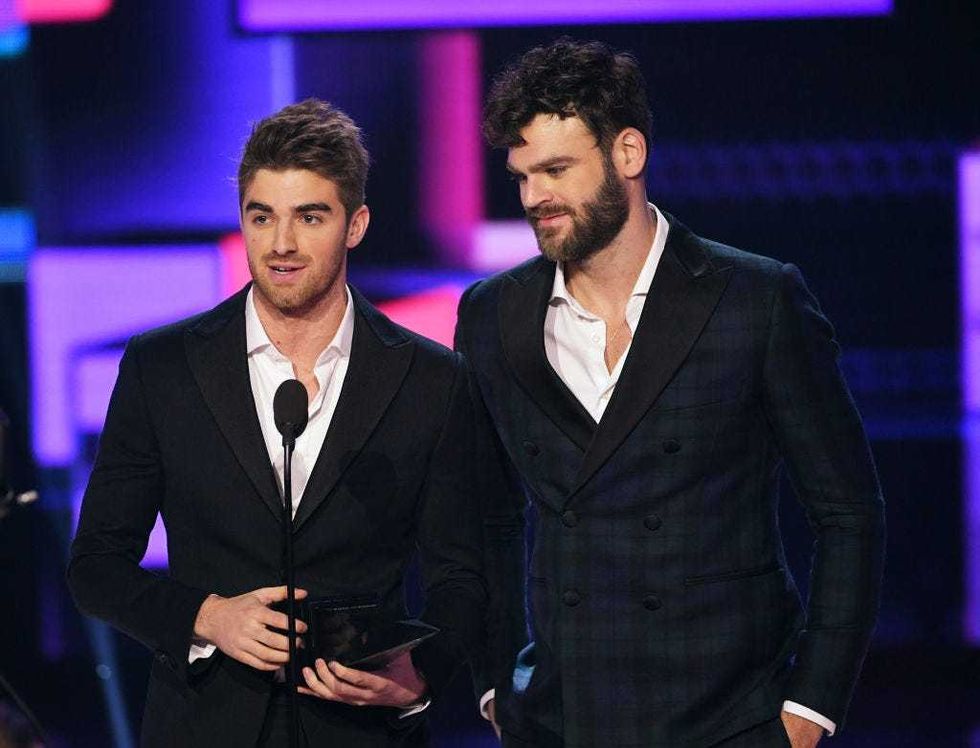 Andrew Taggart (L) and Alex Pall of music group The Chainsmokers accept the Favorite Artist - Electronic Dance Music (EDM) award onstage during the 2017 American Music Awards at Microsoft Theater on November 19, 2017 in Los Angeles, California.